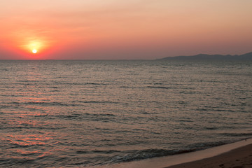 Sea pink sunset. Beautiful color clouds.