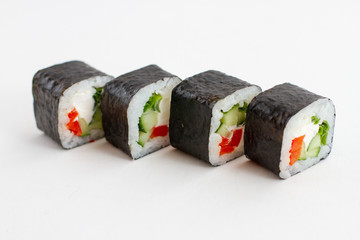 Rolls Sushi with vegetables on a white background