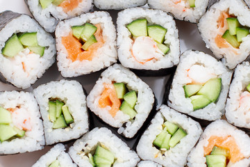Japanese set sushi rolls, close up on white background.