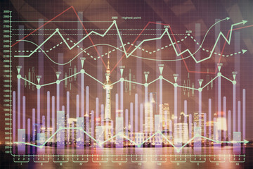 Financial graph on night city scape with tall buildings background multi exposure. Analysis concept.