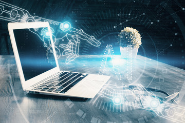 Double exposure of laptop computer and technology theme hologram. Concept of freelance work.