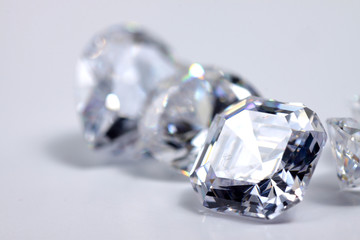Macro shoots of a group of diamonds that has different shapes, heart, round, pear, asscher, oval,...