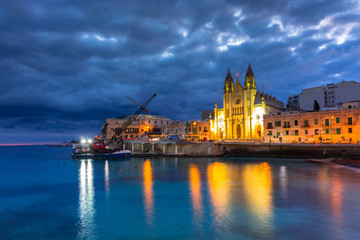 Beautiful church at St. Julians bay at dawn, Malta - obrazy, fototapety, plakaty