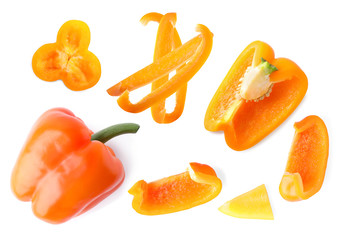 Set of ripe orange bell peppers on white background