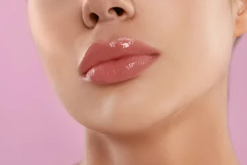 Fotobehang Young woman with beautiful full lips on pink background, closeup © New Africa