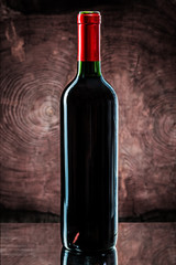 blanc bottle of red wine on vintage wooden background