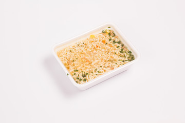 Instant noodles on a white background top view