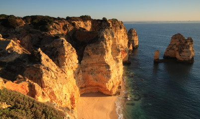 Fototapeta na wymiar Sunrise on cliffs at Ponte ds Piedade, Algarve, Portugal