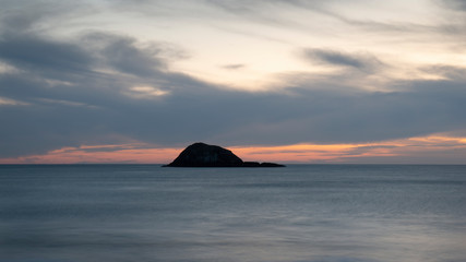 Long exposure image of Muriwai beach at sunset