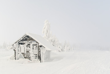 house in the snow in mountain 