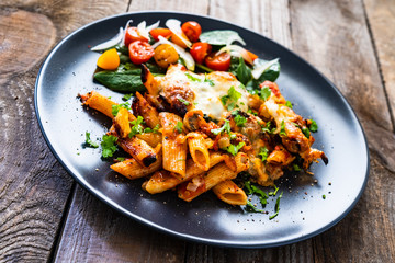 Pasta casserole with barbecue chicken breast, cheese and vegetables