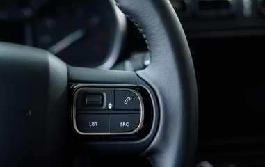 Fototapeta na wymiar Functional car steering wheel with voice control.