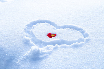 Sunny fresh snow texture with drawn heart symbol. Red heart on snowy background. symbol of love, February 14. Valentines day card.
