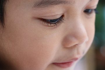 Selective focus cute boy closed up face and eyelash pretty and beauty skin for little child good health background