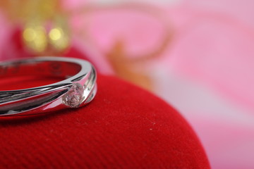 White gold engagement ring on red - heart shaped jewelry box