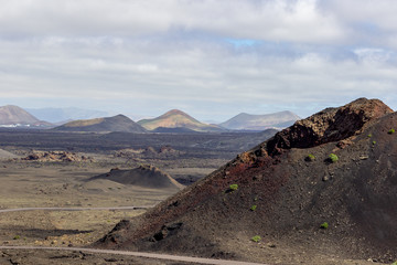 View at multi colored volcanic landscape in Timanfaya Nationalpark on canary island Lanzarote