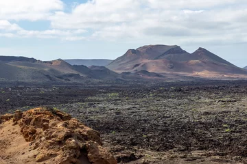 Foto op Canvas View at multi colored volcanic landscape in Timanfaya Nationalpark on canary island Lanzarote © Reiner