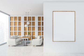 White and wooden cafe with sofas and poster