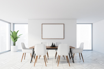 Minimalistic white dining room with poster