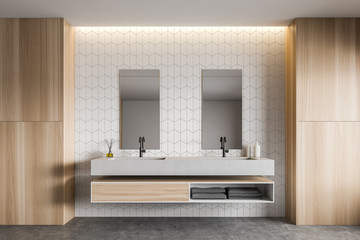 White tile and wood bathroom with double sink