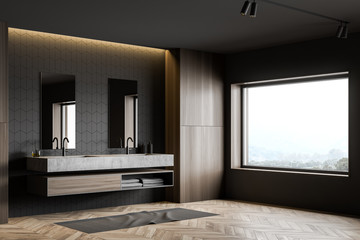 Gray tile and wood bathroom corner with sink