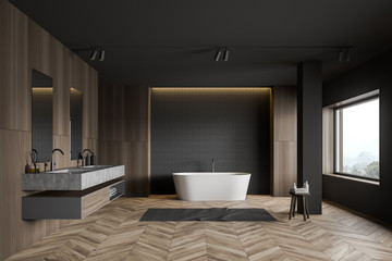 Gray tile and wooden bathroom, tub and sink