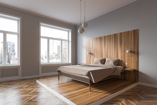 White and wooden bedroom corner with cityscape