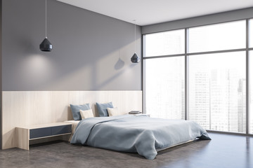 Gray master bedroom corner with cityscape