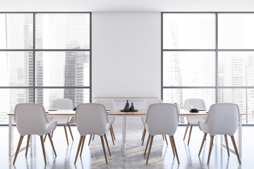 White dining room interior with white chairs