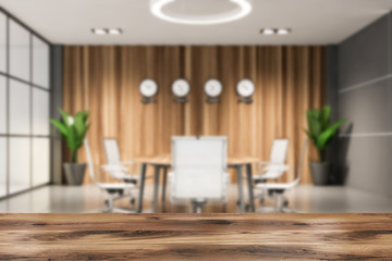 Table in blurry wooden meeting room