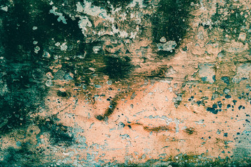 Old rough wall texture for background.  Wallpaper with vintage or retro colors.  Dark orange background