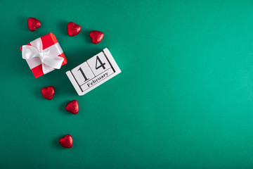 Calendar February 14, hearts on a green background