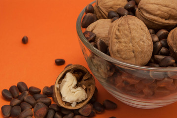 walnuts in bowl on wooden background