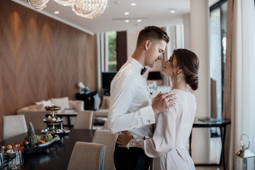 Loving couple at the hotel on a honeymoon.Just married. Honeymoon concept. Romantic relations. True...