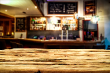 Desk  of free space and blurred bar background 