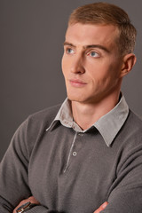 Portrait of handsome young man posing in studio