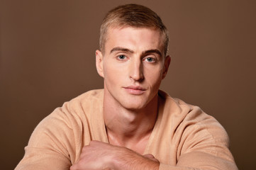 Portrait of handsome young man posing in studio