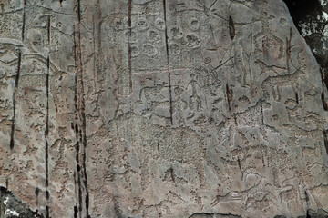 Rock surface with ancient petroglyphs in Altai mountains