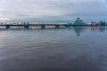 Obraz premium Cityscape View of Riga Latvia with Bridge and River