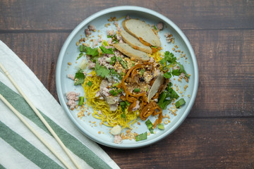 Egg noodles topping minced pork and slic meat ball
