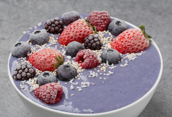 Smoothie bowl with frozen berries, bananas and yogurt. Healthy breakfast. 