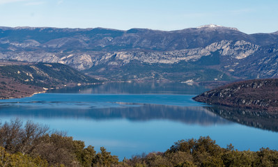 View from the village of Baudinard in Provence to the turquoise and quiet waters of lake of Saint-Croix, pointe de Garruby, mountains of Verdon and Canjuers