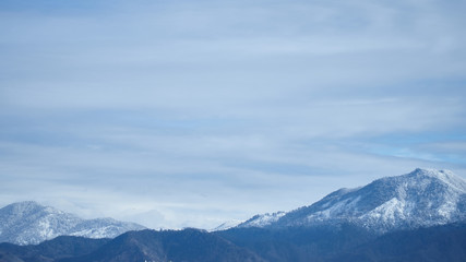 Fototapeta na wymiar Landscape of majestic high snowy mountain tops in the Caucasus, Batumi