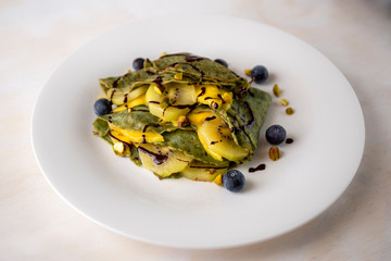 Crepes with blueberry, mango and kiwi