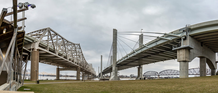 Ground perspective view on John F. Kennedy Memorial Bridge and Abraham Lincoln Bridge in Louisville during daytime