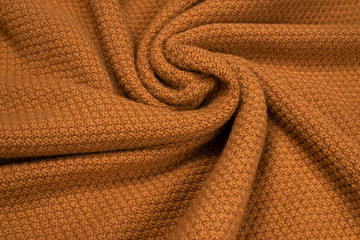 Brown knitted fabric pattern.
