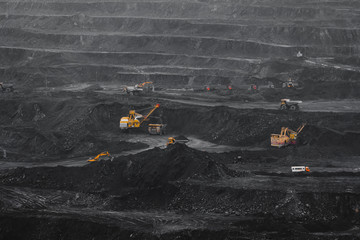 Open pit mine, coal loading in trucks, transportation and logistics