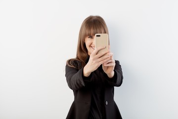 Happy white women taking selfie with phone