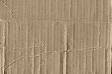 Fototapeta premium Close up grainy decorative light brown vintage rough sheet of carton. Cardboard paper texture blank background. Brown color old pattern empty papercraft surface. Recycled ecology friendly material.