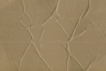 Close up grainy decorative light brown vintage rough sheet of carton. Cardboard paper texture blank background. Brown color old pattern empty papercraft surface. Recycled ecology friendly material.